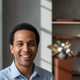 Headshot of a smiling, satisfied customer, mid-30s, against a blurred background in charcoal, burnt sienna, and white.